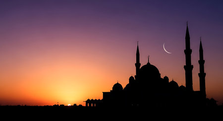 Silhouette of mosque at sunset, Ramadan Kareem background.の素材