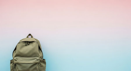 Backpack on pastel background with copy space for text or designの素材