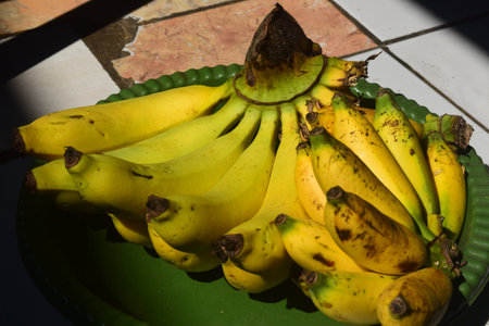 Bunch of bananas on the table, close-up, selective focusの写真素材