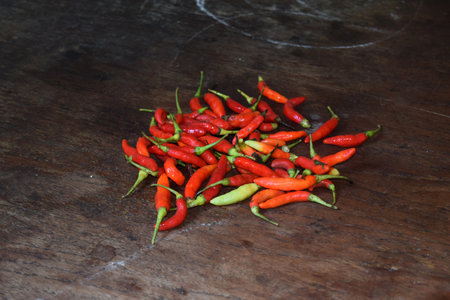 Red chili peppers on a wooden background. Hot chilli pepper.の写真素材