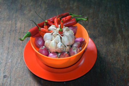 Thai Spicy Chili and Garlic in bowl on wooden backgroundの写真素材
