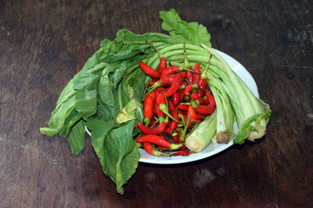 Red chili and green vegetable on the wooden table,Thai foodの写真素材