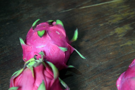 Dragon fruit on wood background, pitaya or pitahaya.の写真素材