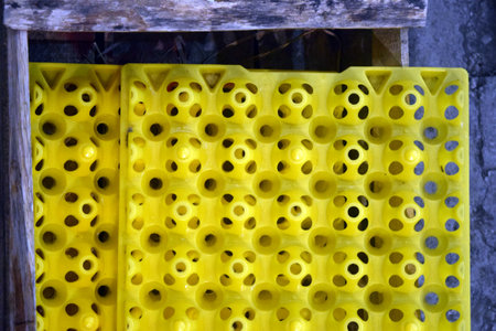 Yellow plastic pipes on a shelf in the store. Background and texture