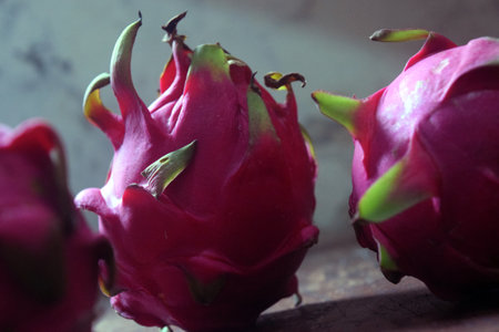 Dragon fruit on wooden table, close up. Exotic tropical fruit.の写真素材