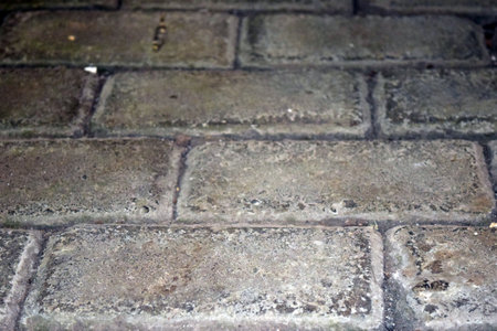 Old cobblestone pavement in the city. Abstract background for design.
