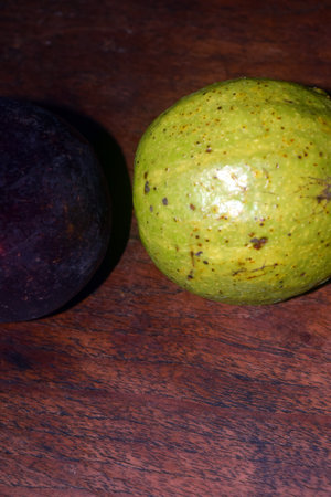 Mango and figs on a wooden table, close-upの写真素材