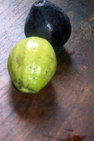 Lemon and lime on a wooden table. Selective focus.の写真素材