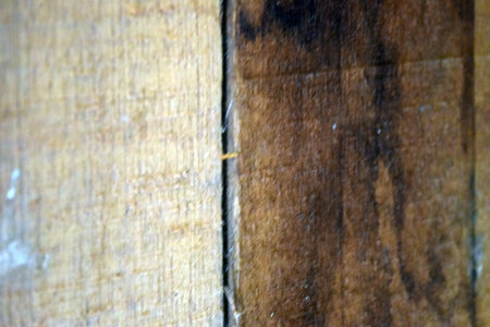 abstract background of old wood planks with knots and nail holesの写真素材