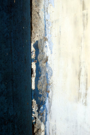 Old blue wall with peeling paint. Shallow depth of field.の写真素材
