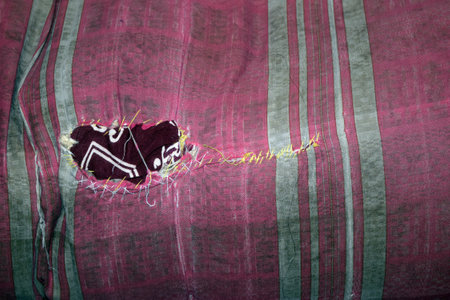 Texture, background, pattern. The fabric is painted in red, black and white, with a picture of a heart.の写真素材