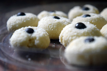 Coconut cookies with blueberries on a plate. Selective focus.の写真素材