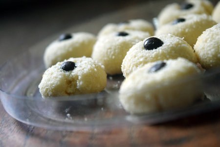 Coconut cookies with black olives on a glass plate.の写真素材