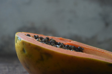 Papaya fruit on a wooden table. Selective focus.