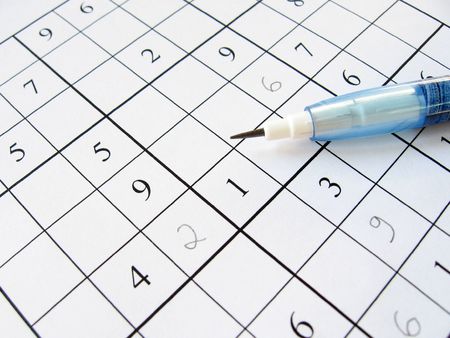 A partially filled sudoku puzzle with pencil.の写真素材