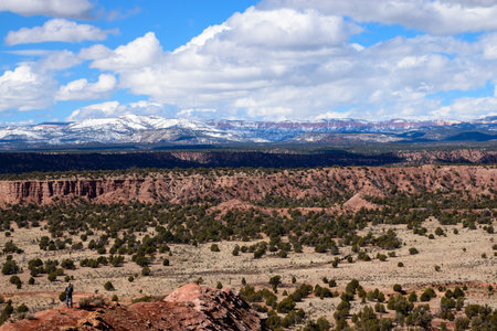 Explore the breathtaking landscape of Utah's Kodachrome Basin State Park, featuring a vast desert terrain with snowy mountains in the background.の写真素材