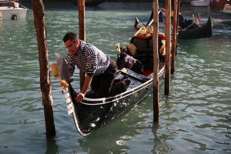 Gondolier polishing his gondola in Venice, Italy, 5th March 2011のeditorial素材