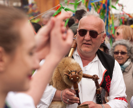 PRAGUE, CZECH REPUBLIC - APRIL 15, 2017: Easter at the Old Town Square - People in traditional Czech costumes play bagpipes and teach tourists how to danceのeditorial素材