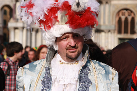 Man in a Venetian costume at the carnival in Venice, Italy, in front of the Basilica San Marco, 5th March 2011のeditorial素材