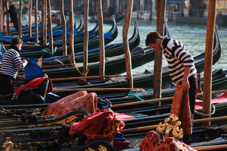 Gondoliers preparing their gondolas on the Grand Canal in Venice, Italy, 5th March 2011のeditorial素材