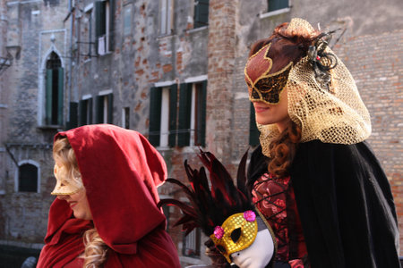 Women in costumes and masks at the Venice carnival in the old town of Venice, Italy, 5th March 2011のeditorial素材