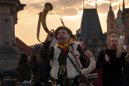 PRAGUE, CZECH REPUBLIC - APRIL 30, 2017: Participants of a costumed parade in the streets of Prague on witch burning night ("carodejnice"), with Mala Strana in tbe backgroundのeditorial素材