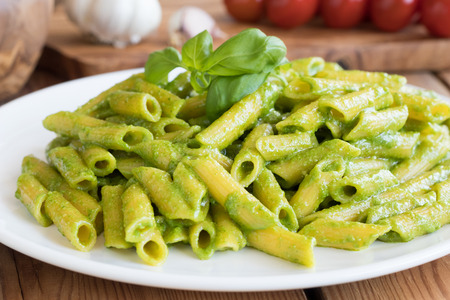 Cooked pasta with fresh Italian basil pesto.の写真素材