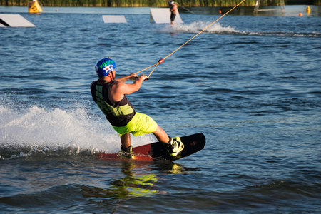 PASOHLAVKY, CZECH REPUBLIC - JUNE 26, 2017: Rider wakeboarding in the cable wake park Wake Merkur in South Moraviaのeditorial素材