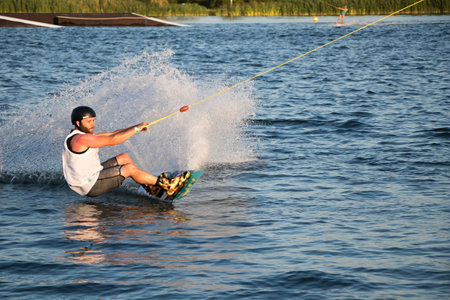 PASOHLAVKY, CZECH REPUBLIC - JUNE 24, 2017: Rider wakeboarding in the cable wake park Wake Merkur in South Moraviaのeditorial素材
