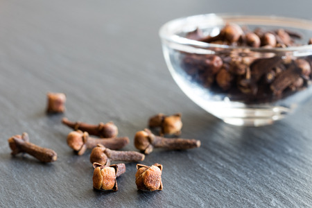 Dry cloves (spice) on a dark background with copy spaceの写真素材