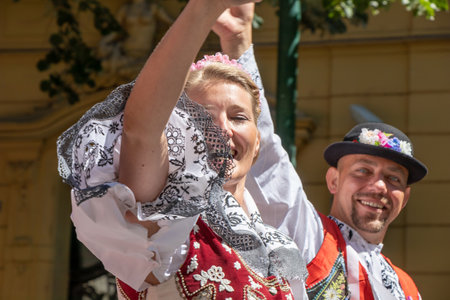 PRAGUE, CZECH REPUBLIC - JULY 1, 2018: People in Moravian folk costumes parading at Sokolsky Slet, a once-every-six-years gathering of the Sokol movement - a Czech sports associationのeditorial素材