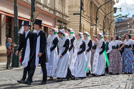 PRAGUE, CZECH REPUBLIC - JULY 1, 2018: People in folk costumes parading at Sokolsky Slet, a once-every-six-years gathering of the Sokol movement - a Czech sports associationのeditorial素材