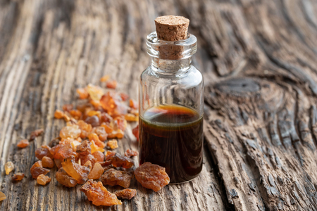 A bottle of essential oil with myrrh resinの写真素材