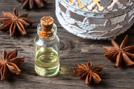 A bottle of essential oil with dried star aniseの写真素材
