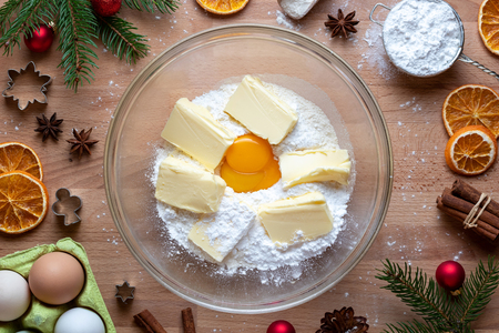 Flour, sugar, egg yolk and butter - ingredients to prepare traditional Linzer Christmas cookiesの写真素材
