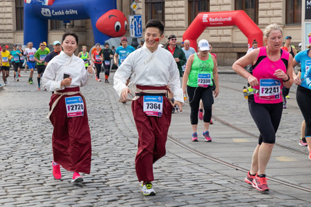 PRAGUE, CZECH REPUBLIC - MAY 7, 2017: Asian couple participating in the Prague International Marathonのeditorial素材