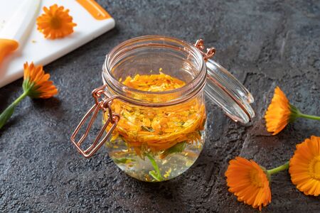 Preparation of herbal tincture from blooming calendula plantの写真素材