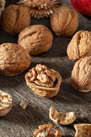Closeup of whole and broken walnuts