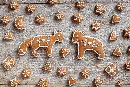 Homemade Christmas gingerbread cookies in the form of forest animals and stars, top viewの写真素材