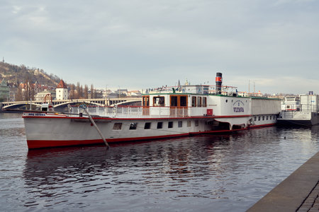 PRAGUE, CZECH REPUBLIC - DECEMBER 5, 2020: Boat at the Vltava riverbankのeditorial素材