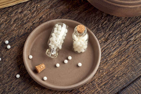 A bottle of homeopathic remedies on a table