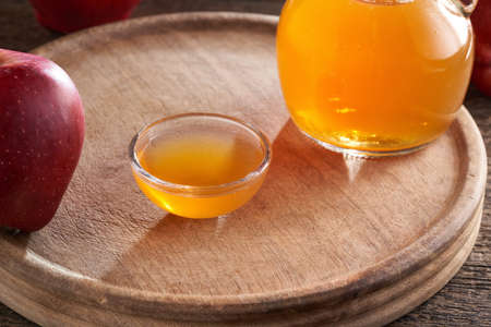 Apple cider vinegar in a bowl and in a jug