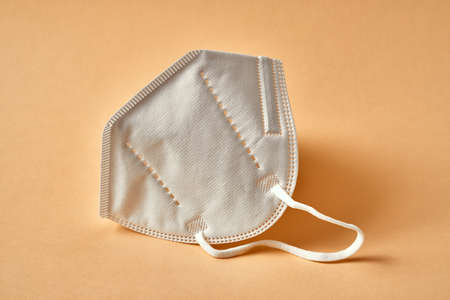 Closeup of a white FFP2 or KN95 respirator, destined to prevent the spread of the virus
