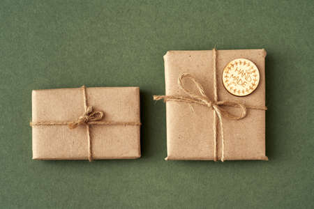 Presents wrapped in ecological recycled paper with wooden inscription Handmade, top view
