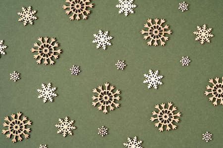 Christmas background with wooden stars on green paper, top viewの写真素材