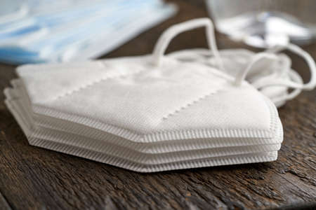 Closeup of a stack of white FFP2 or KN95 respirators, destined to prevent the coronavirus COVID-19 pandemicの写真素材