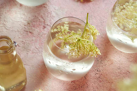 Summer drink with homemade elder flower syrup in a glassの写真素材