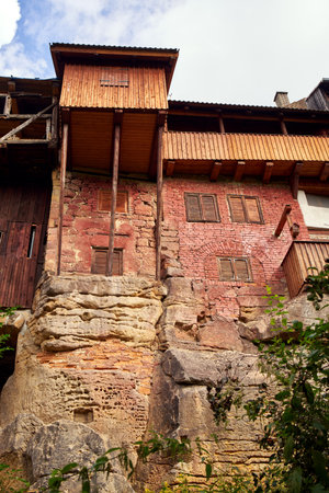 USTEK, CZECH REPUBLIC - AUGUST 29, 2021: So called bird houses made of wood, which have adjacent cellars and passages carved in sandstone rockのeditorial素材