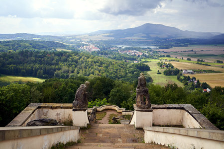USTEK, CZECH REPUBLIC - AUGUST 29, 2021: Pilgrimage place on a hill called Kalvarie or calvary, with summer landscape in the backgroundのeditorial素材