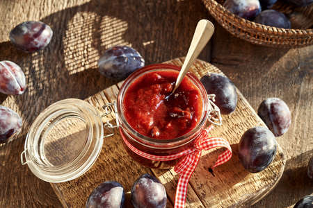 Klevela - homemade preserved product similar to plum jam, on a table in sunlightの写真素材